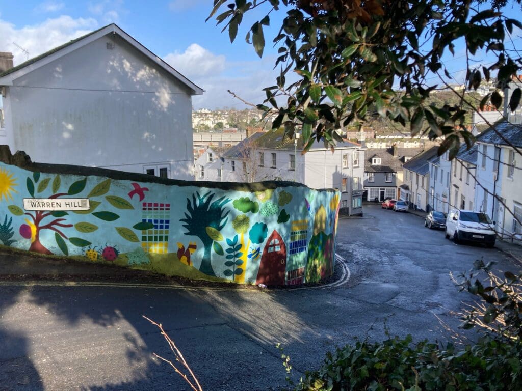 A picture of Warren Hill road in Torquay. The image highlights a colourful mural
