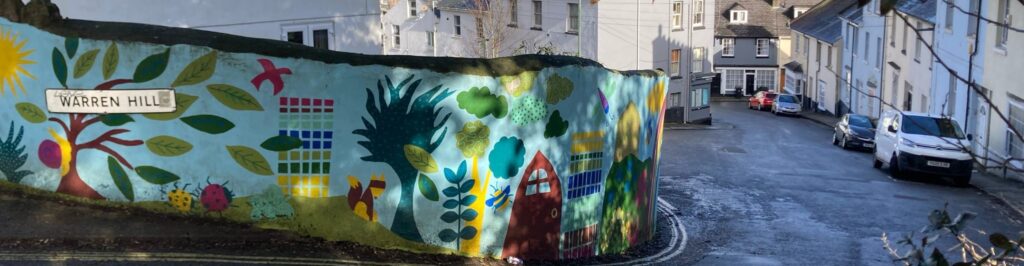 An image of Warren Hill in Torquay. the image features a colourful mural
