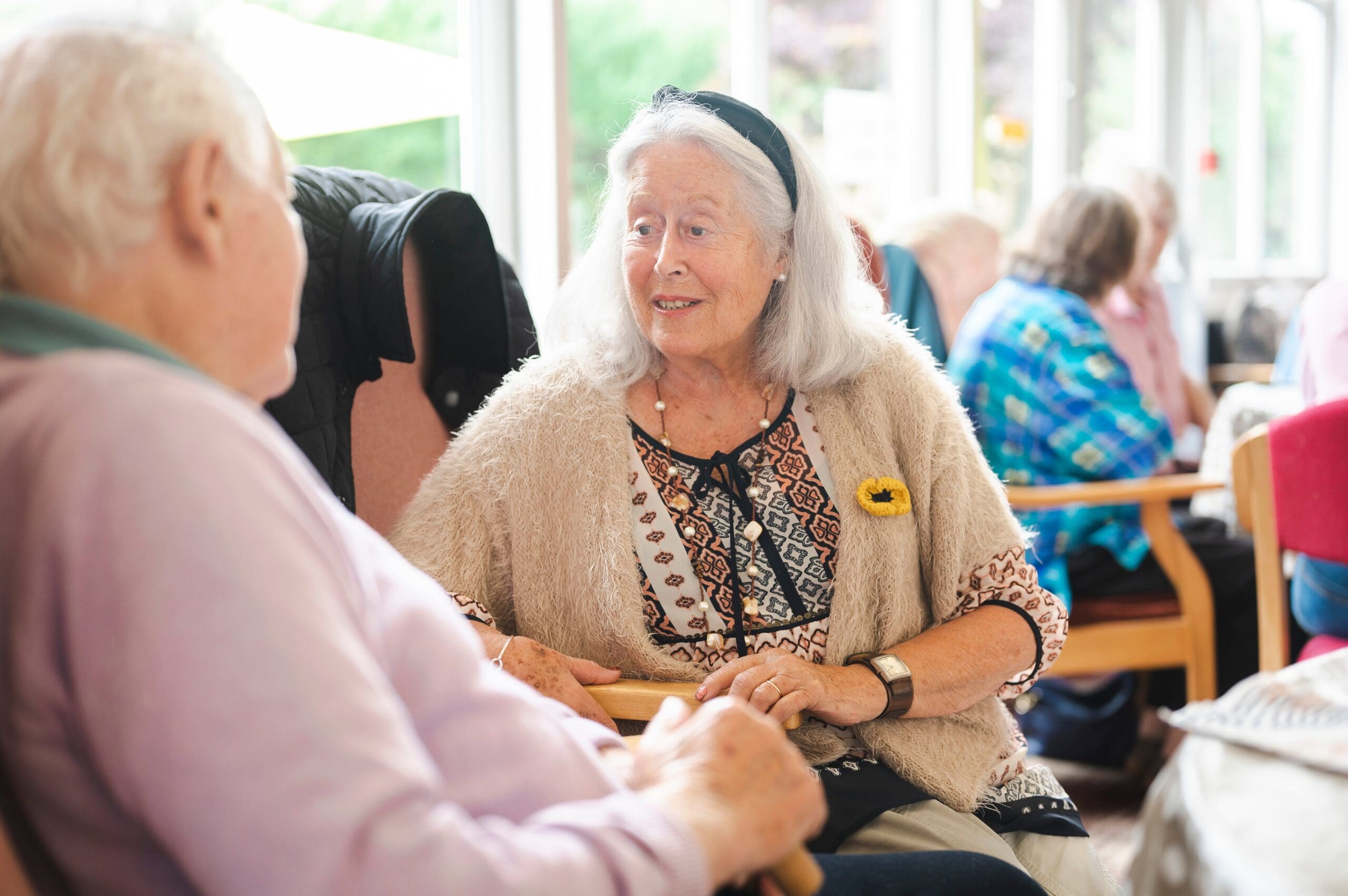 Older lady and gentleman having a chat.